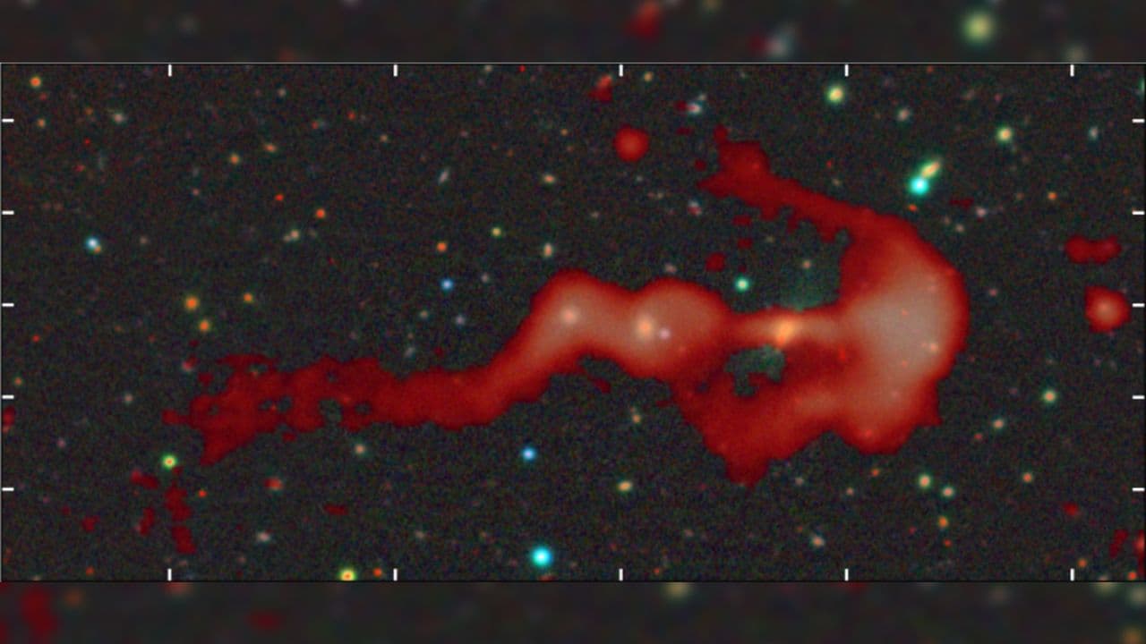 Strange glowing 'bow-and-arrow' structure may be a giant cosmic shock wave created by a supersonic galaxy collision