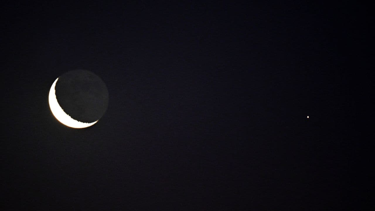 Don't miss the crescent moon shine close to the red light of Mars before dawn on Aug. 9