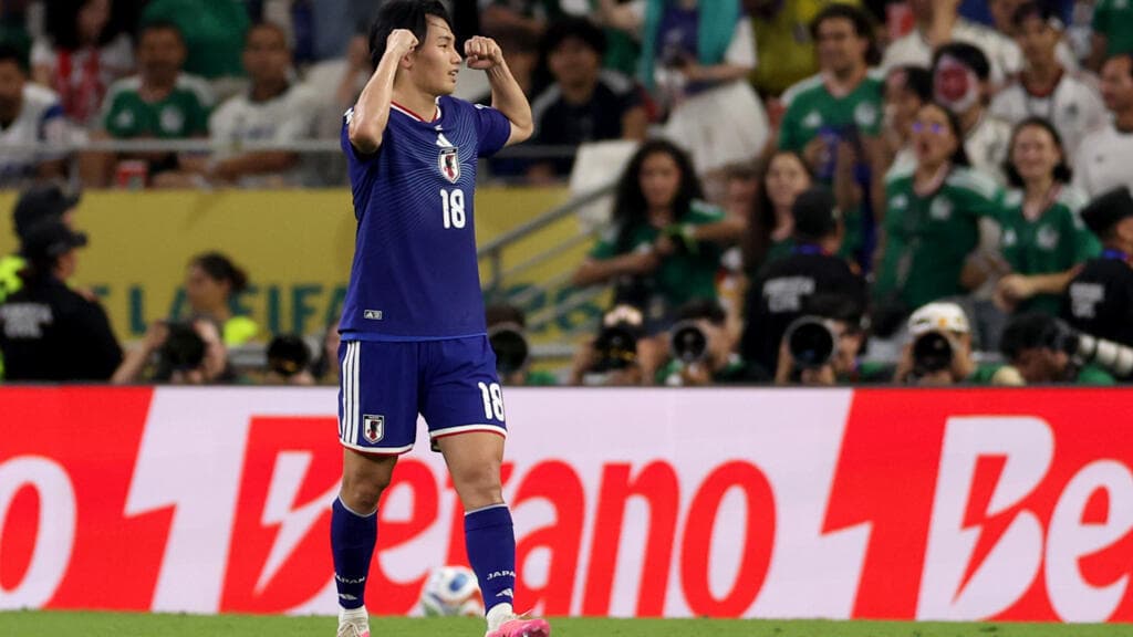 Ueda shines as Japan knocks out Tunisia in World Cup's 1,000th game