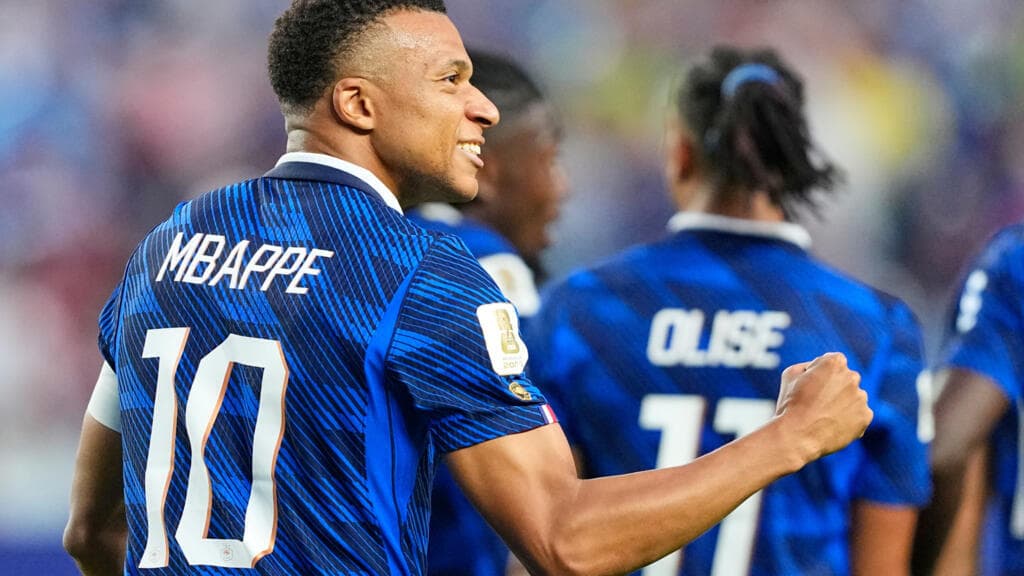 World Cup: France into last 32 with win over Iraq despite two-hour weather delay