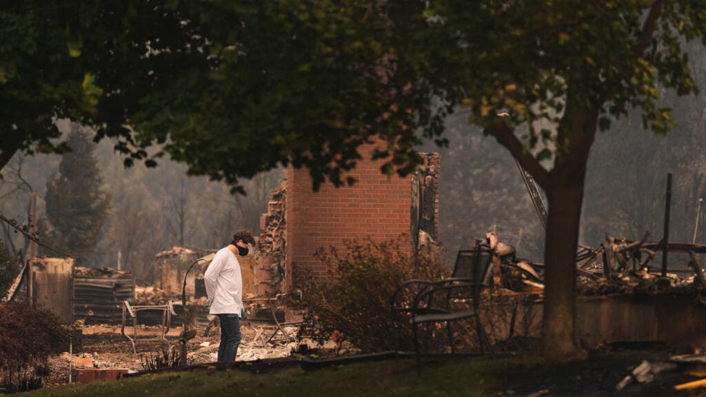 US northwest wildfires force 65,000 to flee as hundreds of buildings burn in Spokane