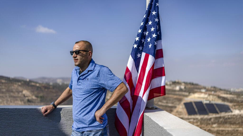 Palestinian-American citizen raises US flag over besieged West Bank home