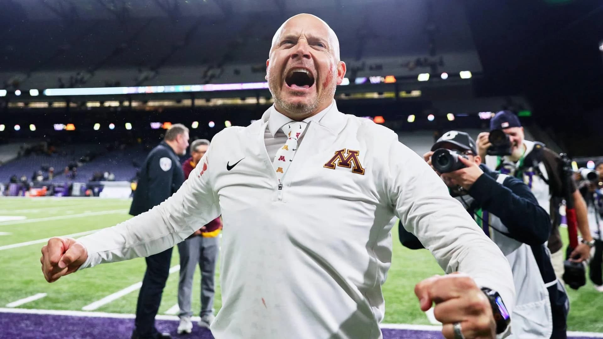 WATCH: Minnesota coach P.J. Fleck smears player's blood on his face after upset win over Washington