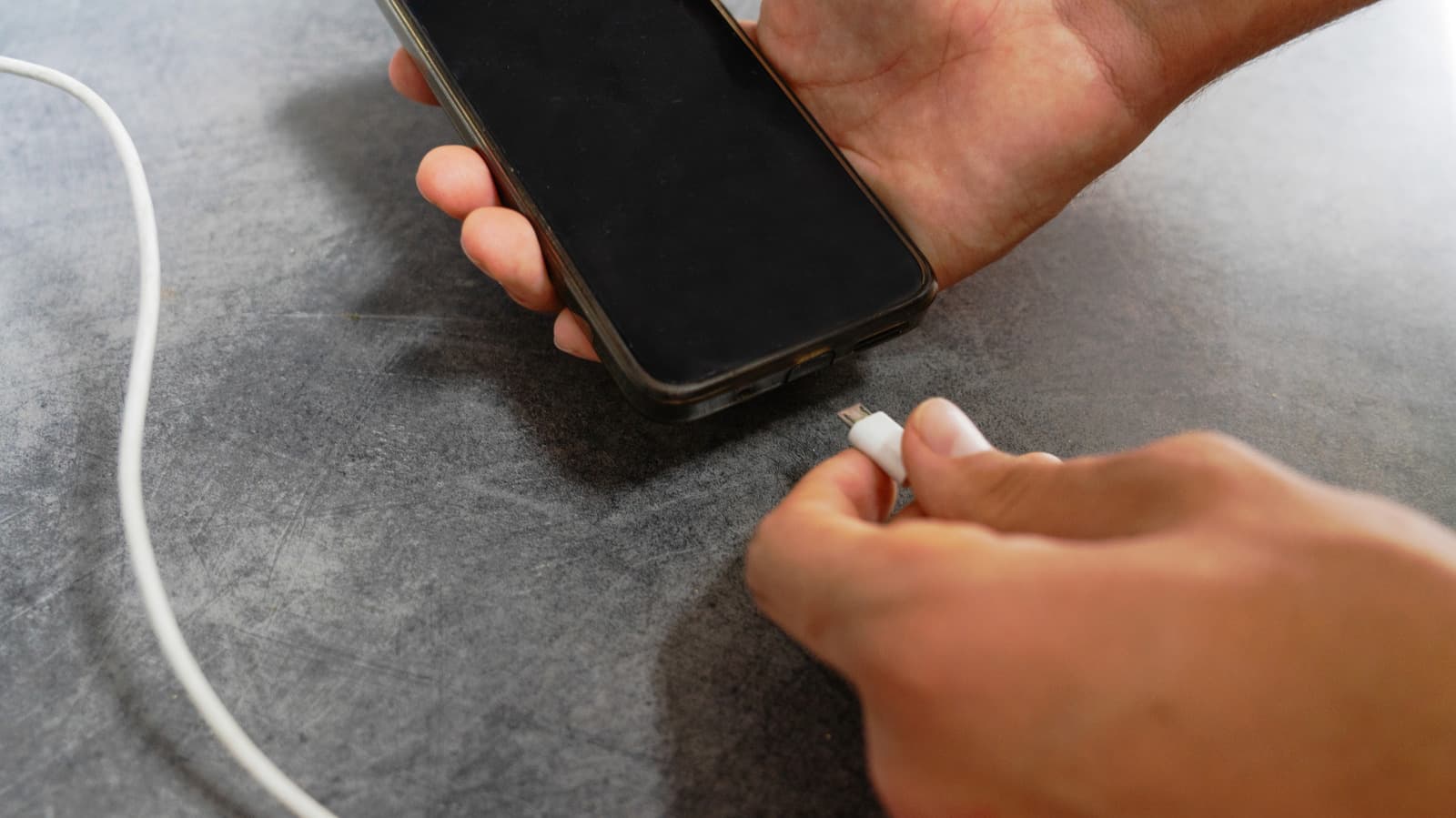 Why do phones still use battery when powered off?